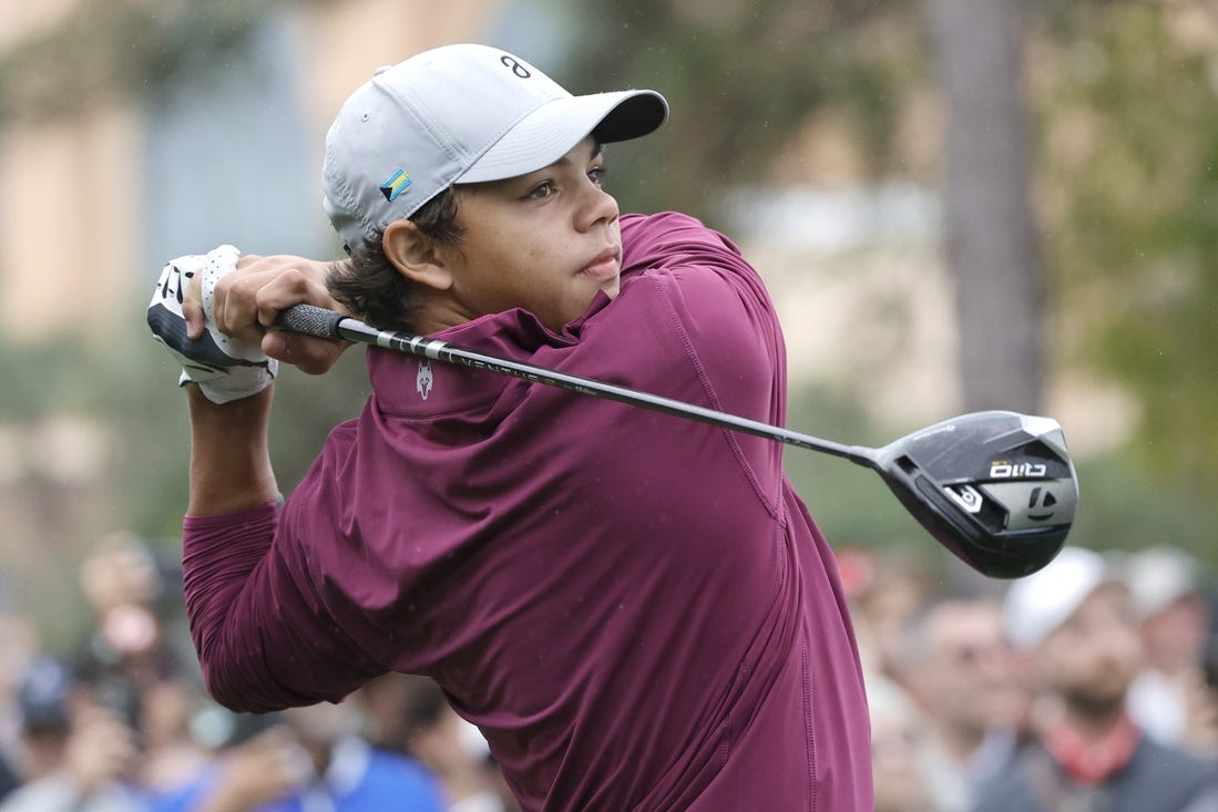 Dec 17, 2023; Orlando, Florida, USA;  Charlie Woods plays his shot from the first tee during the PNC Championship at The Ritz-Carlton Golf Club. Mandatory Credit: Reinhold Matay-USA TODAY Sports