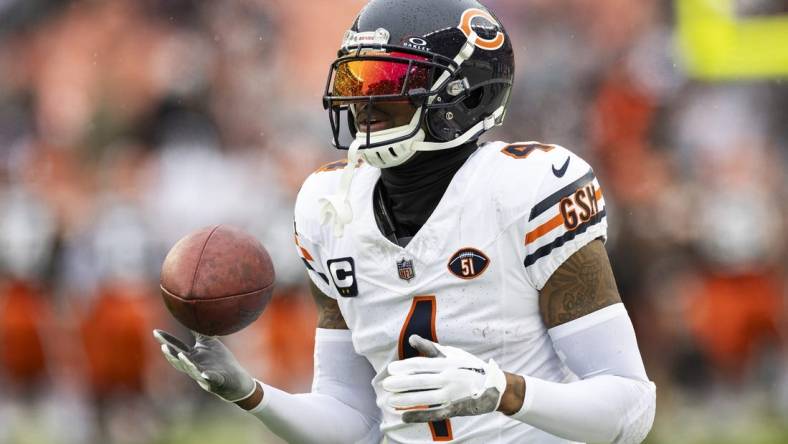 Dec 17, 2023; Cleveland, Ohio, USA; Chicago Bears safety Eddie Jackson (4) catches the ball during warm ups before the game against the Cleveland Browns at Cleveland Browns Stadium. Mandatory Credit: Scott Galvin-USA TODAY Sports