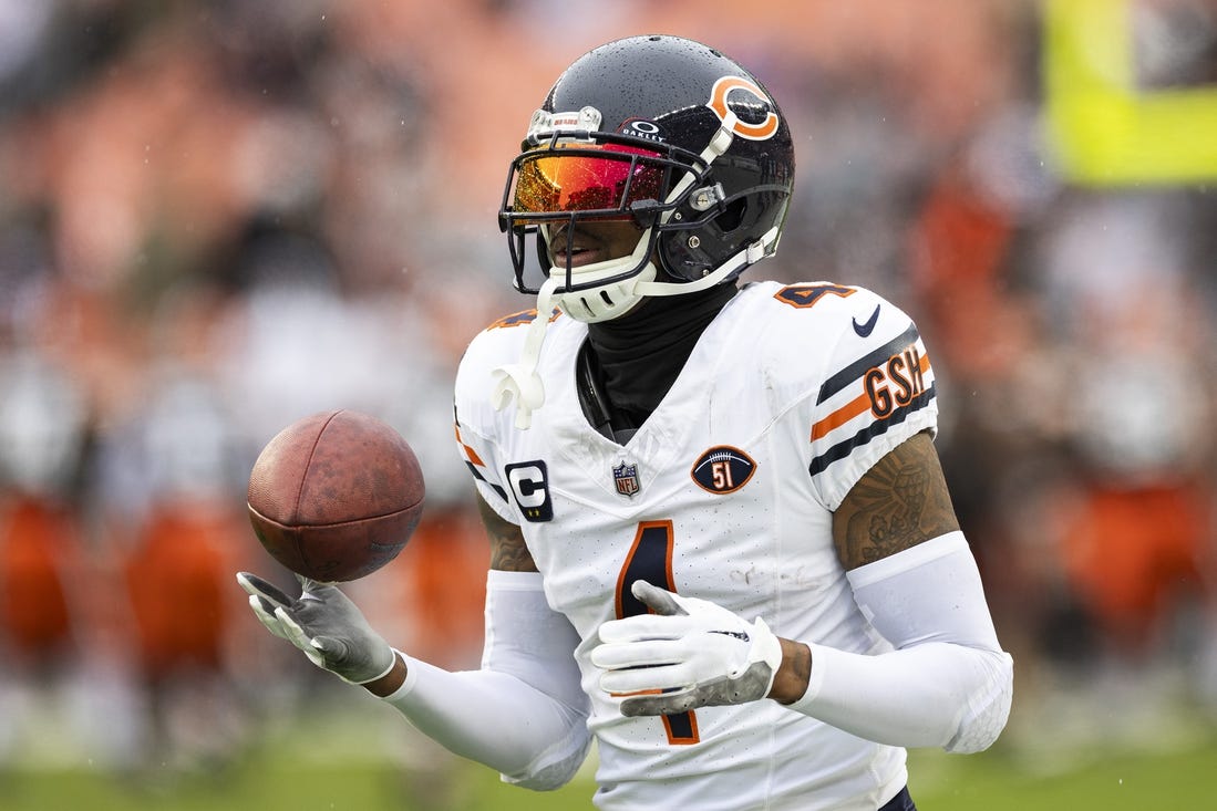 Dec 17, 2023; Cleveland, Ohio, USA; Chicago Bears safety Eddie Jackson (4) catches the ball during warm ups before the game against the Cleveland Browns at Cleveland Browns Stadium. Mandatory Credit: Scott Galvin-USA TODAY Sports