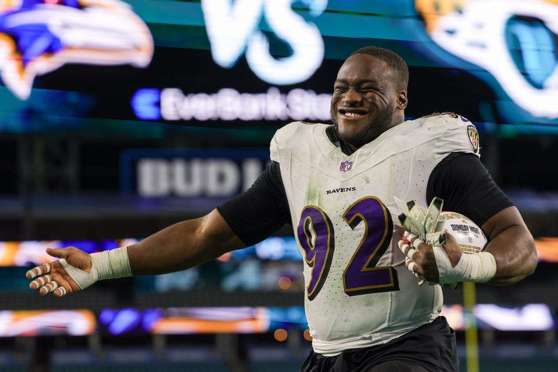 Dec 17, 2023; Jacksonville, Florida, USA;  Baltimore Ravens defensive tackle Justin Madubuike (92) celebrates after beating the Jacksonville Jaguars at EverBank Stadium. Mandatory Credit: Nathan Ray Seebeck-USA TODAY Sports