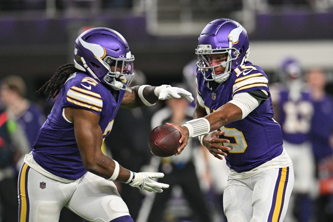 Nov 27, 2023; Minneapolis, Minnesota, USA; Minnesota Vikings quarterback Joshua Dobbs (15) hands the ball off to running back Alexander Mattison (2) during the game against the Chicago Bears at U.S. Bank Stadium. Mandatory Credit: Jeffrey Becker-USA TODAY Sports