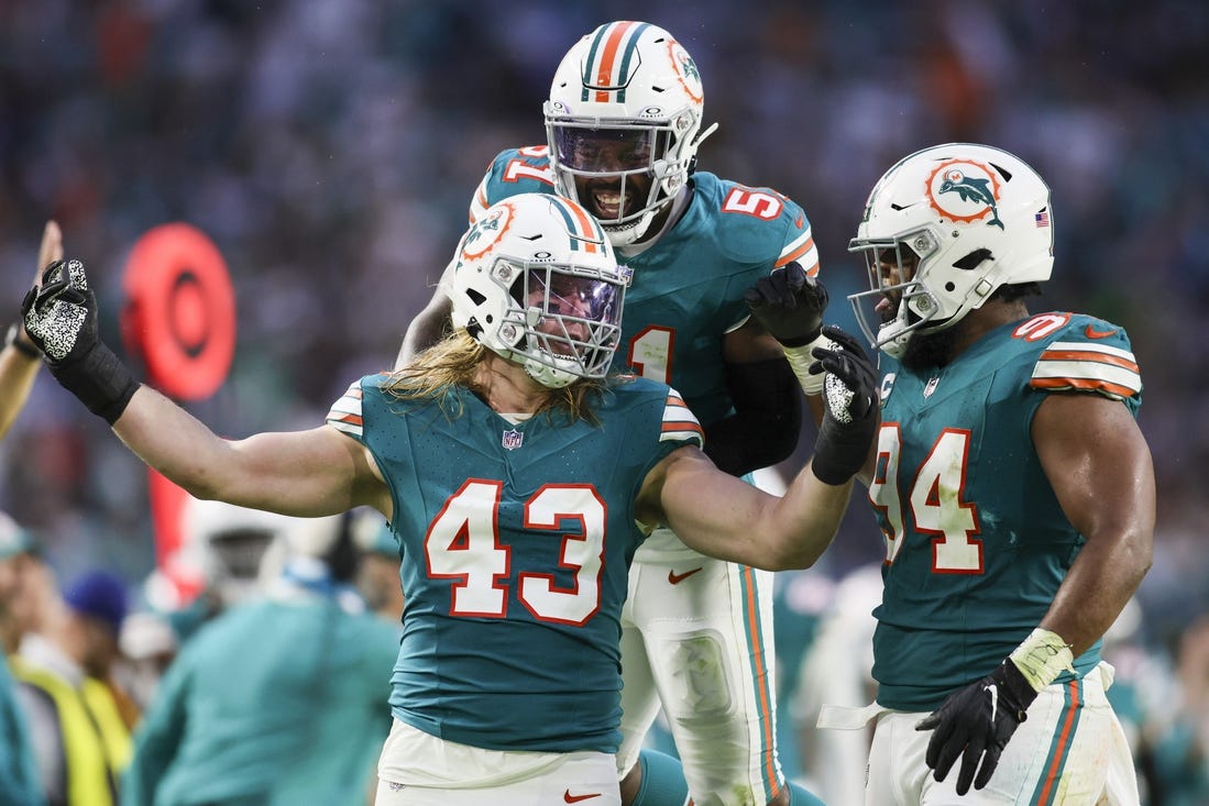 Dec 24, 2023; Miami Gardens, Florida, USA; Miami Dolphins linebacker Andrew Van Ginkel (43) celebrates with defensive tackle Christian Wilkins (94) and linebacker David Long Jr. (51) after a play against the Dallas Cowboys during the second quarter at Hard Rock Stadium. Mandatory Credit: Sam Navarro-USA TODAY Sports