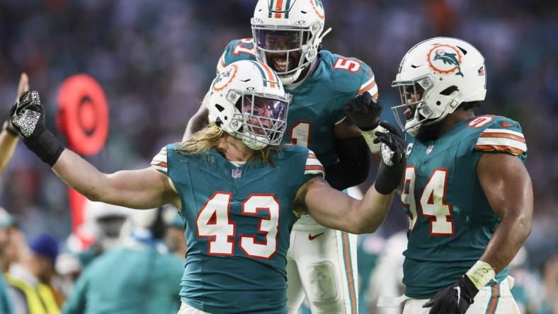 Dec 24, 2023; Miami Gardens, Florida, USA; Miami Dolphins linebacker Andrew Van Ginkel (43) celebrates with defensive tackle Christian Wilkins (94) and linebacker David Long Jr. (51) after a play against the Dallas Cowboys during the second quarter at Hard Rock Stadium. Mandatory Credit: Sam Navarro-USA TODAY Sports