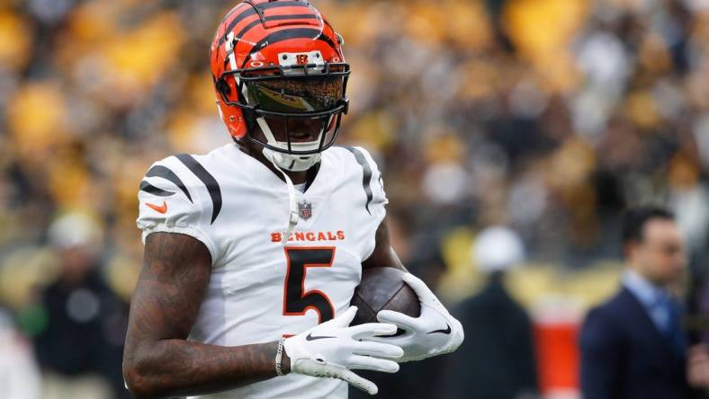 Dec 23, 2023; Pittsburgh, Pennsylvania, USA;  Cincinnati Bengals wide receiver Tee Higgins (5) warms up before the game against the Pittsburgh Steelers at Acrisure Stadium. Mandatory Credit: Charles LeClaire-USA TODAY Sports