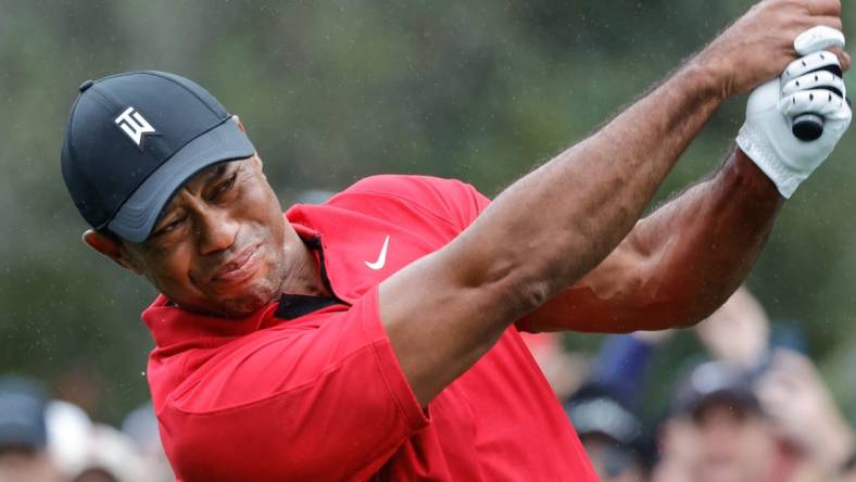 Dec 17, 2023; Orlando, Florida, USA;  Tiger Woods plays his shot from the first tee during the PNC Championship at The Ritz-Carlton Golf Club. Mandatory Credit: Reinhold Matay-USA TODAY Sports