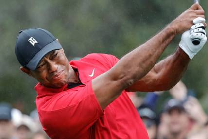 Dec 17, 2023; Orlando, Florida, USA;  Tiger Woods plays his shot from the first tee during the PNC Championship at The Ritz-Carlton Golf Club. Mandatory Credit: Reinhold Matay-USA TODAY Sports