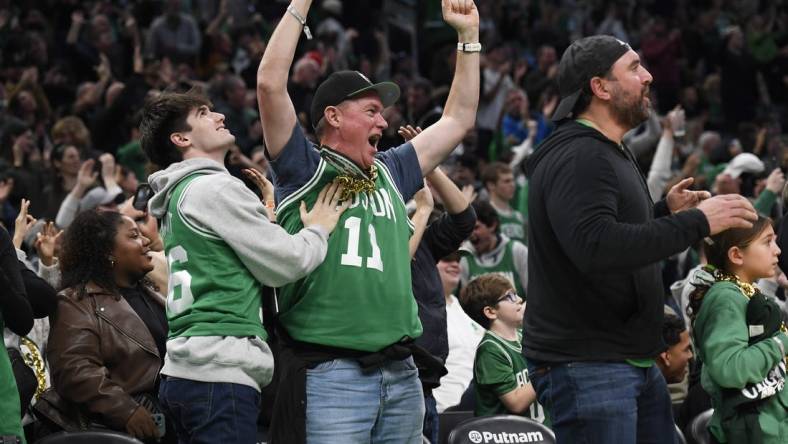 Dec 28, 2023; Boston, Massachusetts, USA;  Boston Celtics fans cheer during the second half against the Detroit Pistons at TD Garden. Mandatory Credit: Bob DeChiara-USA TODAY Sports