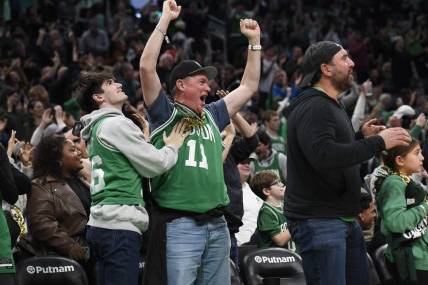 Dec 28, 2023; Boston, Massachusetts, USA;  Boston Celtics fans cheer during the second half against the Detroit Pistons at TD Garden. Mandatory Credit: Bob DeChiara-USA TODAY Sports