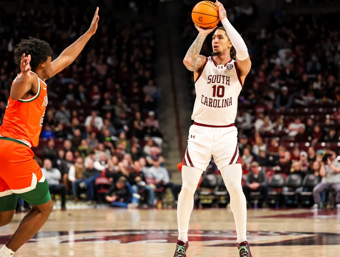 Dec 30, 2023; Columbia, South Carolina, USA; South Carolina Gamecocks guard Myles Stute (10) attempts a three point basket against the Florida A&M Rattlers in the first quarter at Colonial Life Arena. Mandatory Credit: Jeff Blake-USA TODAY Sports