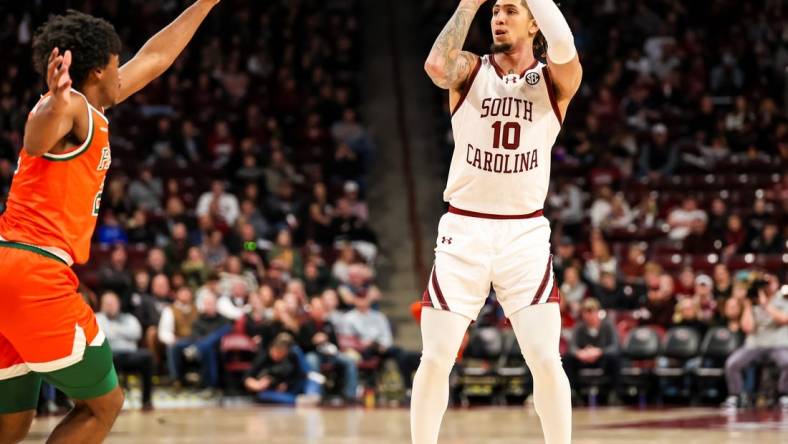 Dec 30, 2023; Columbia, South Carolina, USA; South Carolina Gamecocks guard Myles Stute (10) attempts a three point basket against the Florida A&M Rattlers in the first quarter at Colonial Life Arena. Mandatory Credit: Jeff Blake-USA TODAY Sports