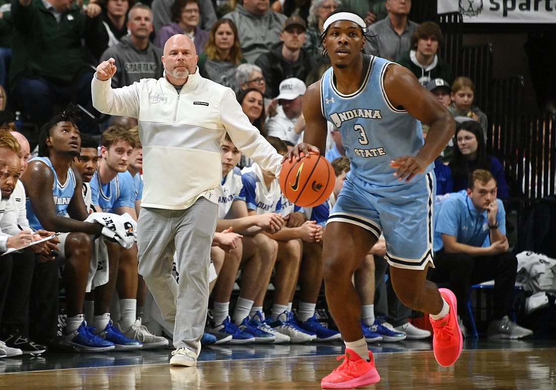 Dec 30, 2023; East Lansing, Michigan, USA; Indiana State Sycamores head coach Josh Schertz shouts directions to his offense including Indiana State Sycamores guard Ryan Conwell (3), during the first half against the Michigan State Spartans at Jack Breslin Student Events Center. Mandatory Credit: Dale Young-USA TODAY Sports