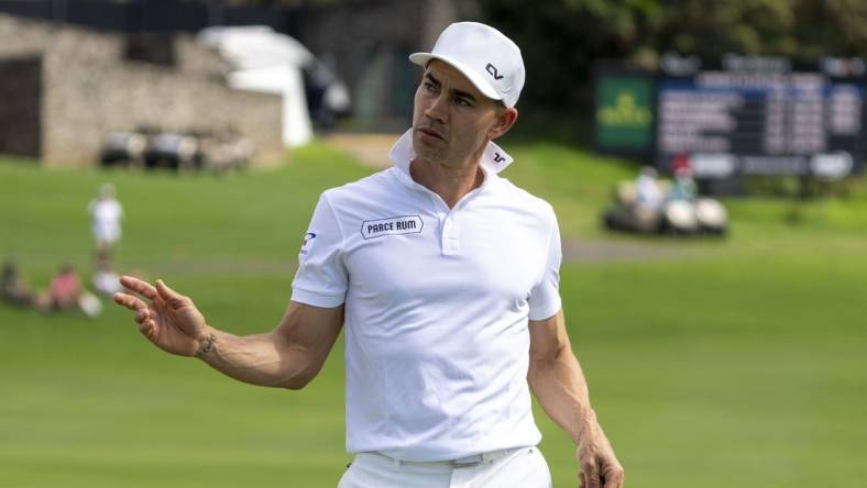 January 4, 2024; Maui, Hawaii, USA; Camilo Villegas acknowledges the crowd after making his putt on the 18th hole during the first round of The Sentry golf tournament at Kapalua Golf - The Plantation Course. Mandatory Credit: Kyle Terada-USA TODAY Sports