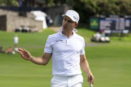 January 4, 2024; Maui, Hawaii, USA; Camilo Villegas acknowledges the crowd after making his putt on the 18th hole during the first round of The Sentry golf tournament at Kapalua Golf - The Plantation Course. Mandatory Credit: Kyle Terada-USA TODAY Sports