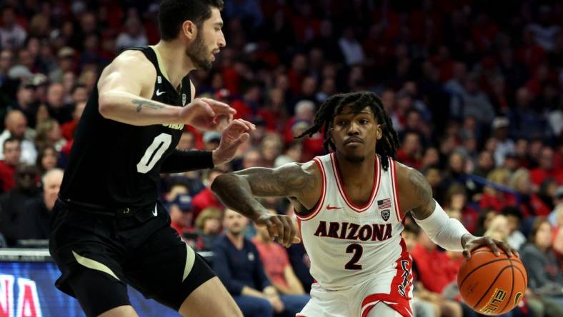 Jan 4, 2024; Tucson, Arizona, USA; Arizona Wildcats guard Caleb Love (2) drives to the net against Colorado Buffaloes guard Luke O'Brien (0) during the second half at McKale Center. Mandatory Credit: Zachary BonDurant-USA TODAY Sports