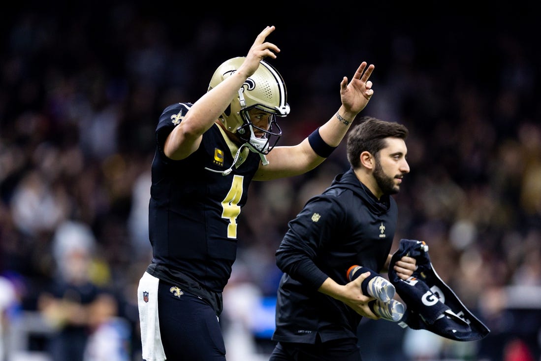 Jan 7, 2024; New Orleans, Louisiana, USA;  New Orleans Saints quarterback Derek Carr (4) reacts to a touchdown against the Atlanta Falcons during the first half at Caesars Superdome. Mandatory Credit: Stephen Lew-USA TODAY Sports