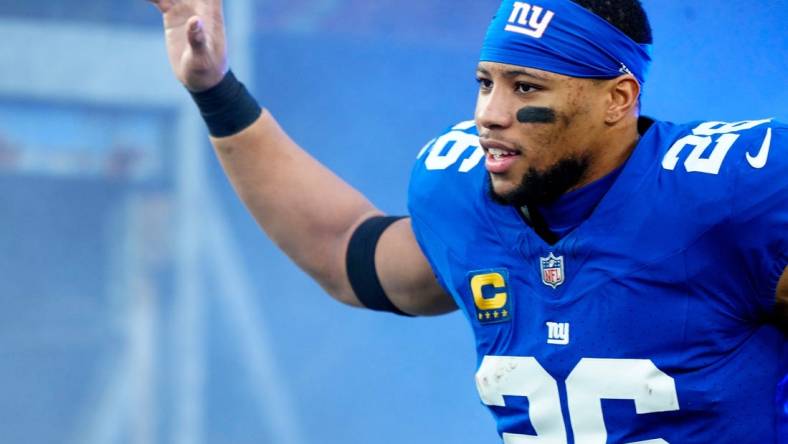 New York Giants running back Saquon Barkley (26) takes the field at MetLife Stadium, Sunday, January 7, 2024.