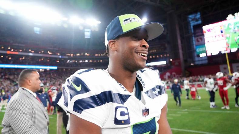 Jan 7, 2024; Glendale, Arizona, USA; Seattle Seahawks quarterback Geno Smith (7) reacts after the game against the Arizona Cardinals at State Farm Stadium. Mandatory Credit: Joe Camporeale-USA TODAY Sports