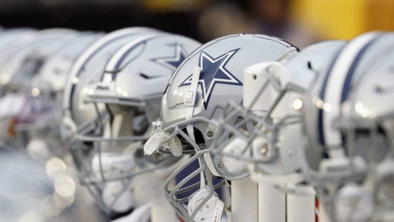 Jan 7, 2024; Landover, Maryland, USA; A view of Dallas Cowboys players' helmets on the bench against the Washington Commanders during the first quarter at FedExField. Mandatory Credit: Geoff Burke-USA TODAY Sports