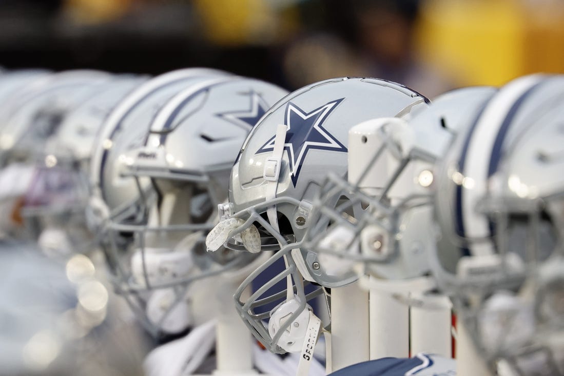 Jan 7, 2024; Landover, Maryland, USA; A view of Dallas Cowboys players' helmets on the bench against the Washington Commanders during the first quarter at FedExField. Mandatory Credit: Geoff Burke-USA TODAY Sports