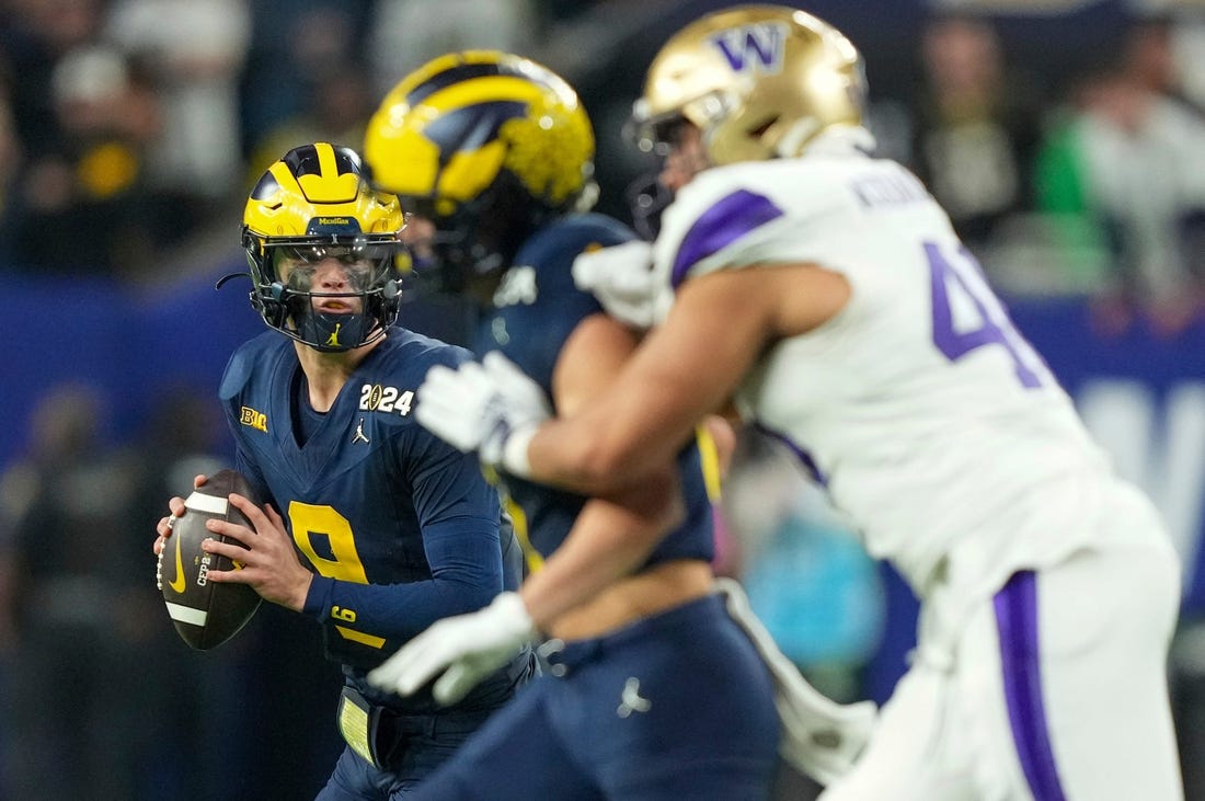 Michigan quarterback J.J. McCarthy (9) looks to pass the ball in the second half of the College Football Playoff national championship game against Washington at NRG Stadium in Houston, Texas on Monday, January 8, 2024.