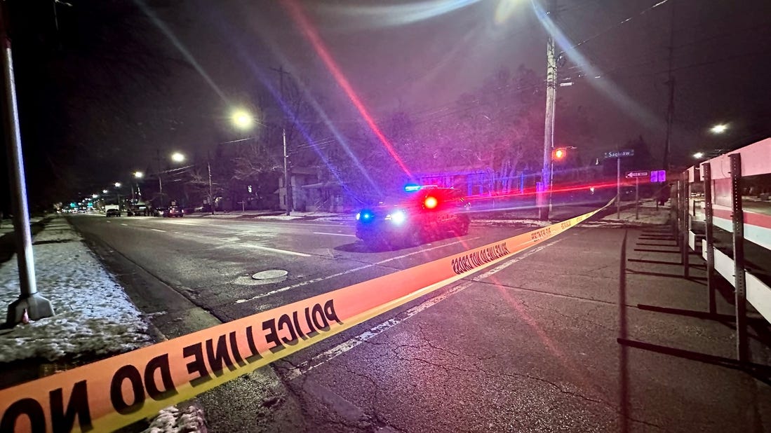 Police tape blocks the road in the 300 block of West Saginaw Street in Lansing, where Lansing police said at least one officer was involved in a shooting on Wednesday, Jan. 10, 2024.
