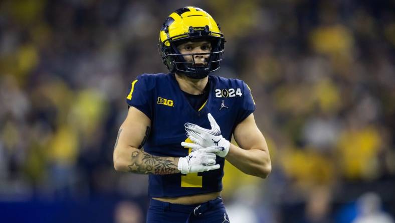 Jan 8, 2024; Houston, TX, USA; Michigan Wolverines wide receiver Roman Wilson (1) against the Washington Huskies during the 2024 College Football Playoff national championship game at NRG Stadium. Mandatory Credit: Mark J. Rebilas-USA TODAY Sports