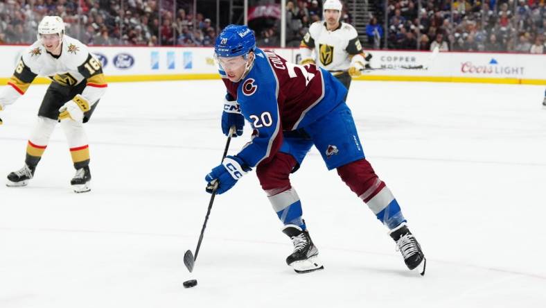 Jan 10, 2024; Denver, Colorado, USA; Colorado Avalanche center Ross Colton (20) controls the puck in the second period against the Vegas Golden Knights at Ball Arena. Mandatory Credit: Ron Chenoy-USA TODAY Sports