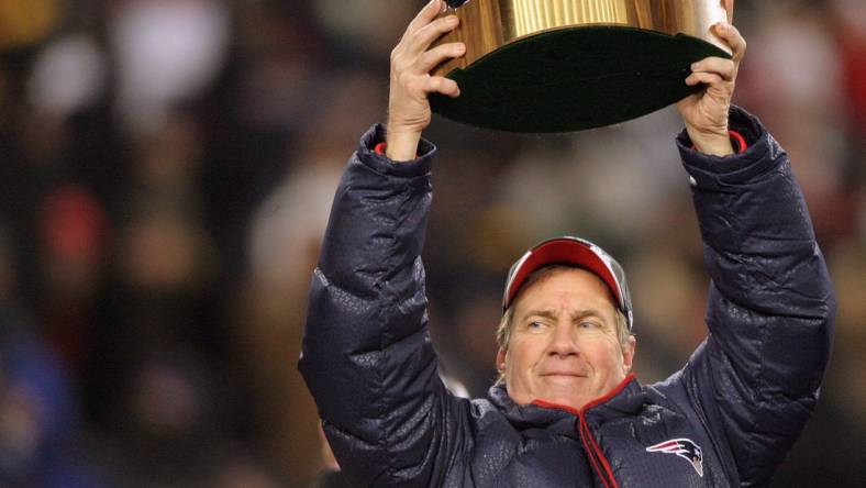 2008: Head Coach Bill Belichick raises the Lamar Hunt trophy after the Patriots won 21-12 over the Chargers for the AFC Championship and advance to Super Bowl XLII.