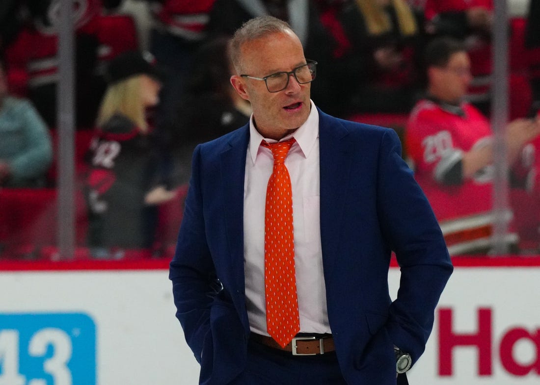 Jan 11, 2024; Raleigh, North Carolina, USA; Anaheim Ducks head coach Greg Cronin walks off the ice after the Ducks loss to the Carolina Hurricanes at PNC Arena. Mandatory Credit: James Guillory-USA TODAY Sports