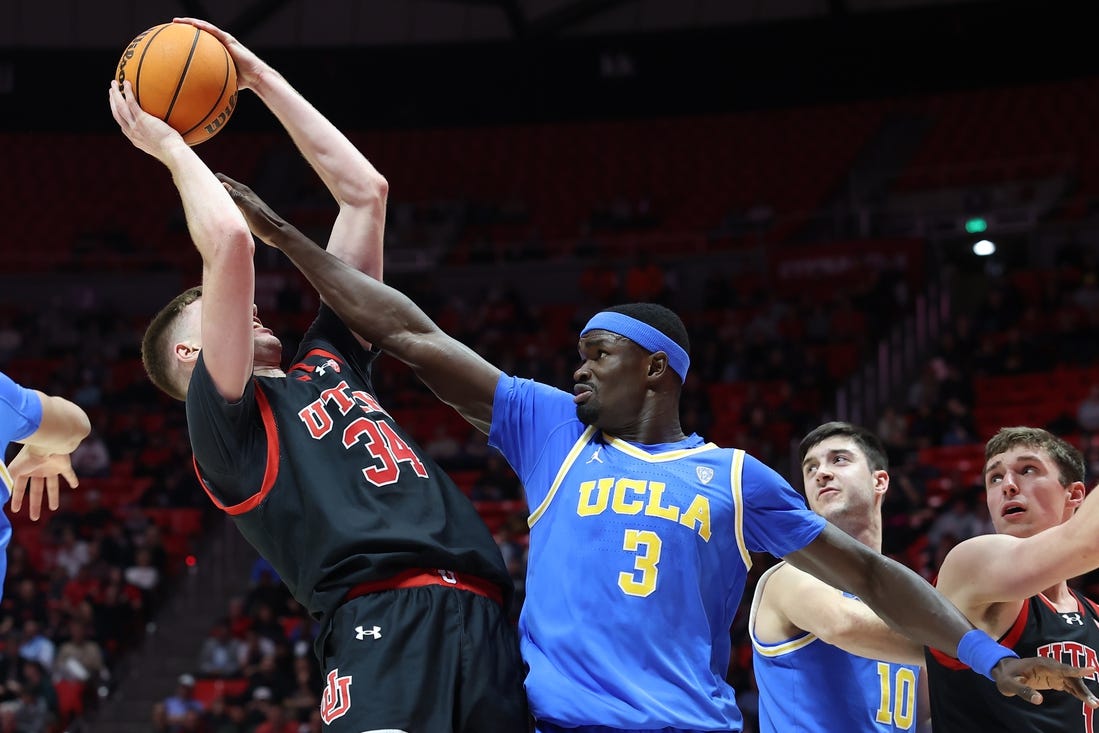 Jan 11, 2024; Salt Lake City, Utah, USA; UCLA Bruins forward Adem Bona (3) defends the shot of Utah Utes center Lawson Lovering (34) during the second half at Jon M. Huntsman Center. Mandatory Credit: Rob Gray-USA TODAY Sports