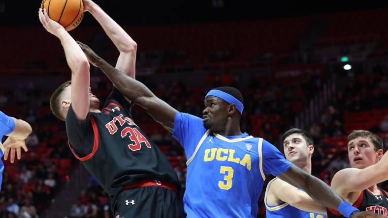 Jan 11, 2024; Salt Lake City, Utah, USA; UCLA Bruins forward Adem Bona (3) defends the shot of Utah Utes center Lawson Lovering (34) during the second half at Jon M. Huntsman Center. Mandatory Credit: Rob Gray-USA TODAY Sports