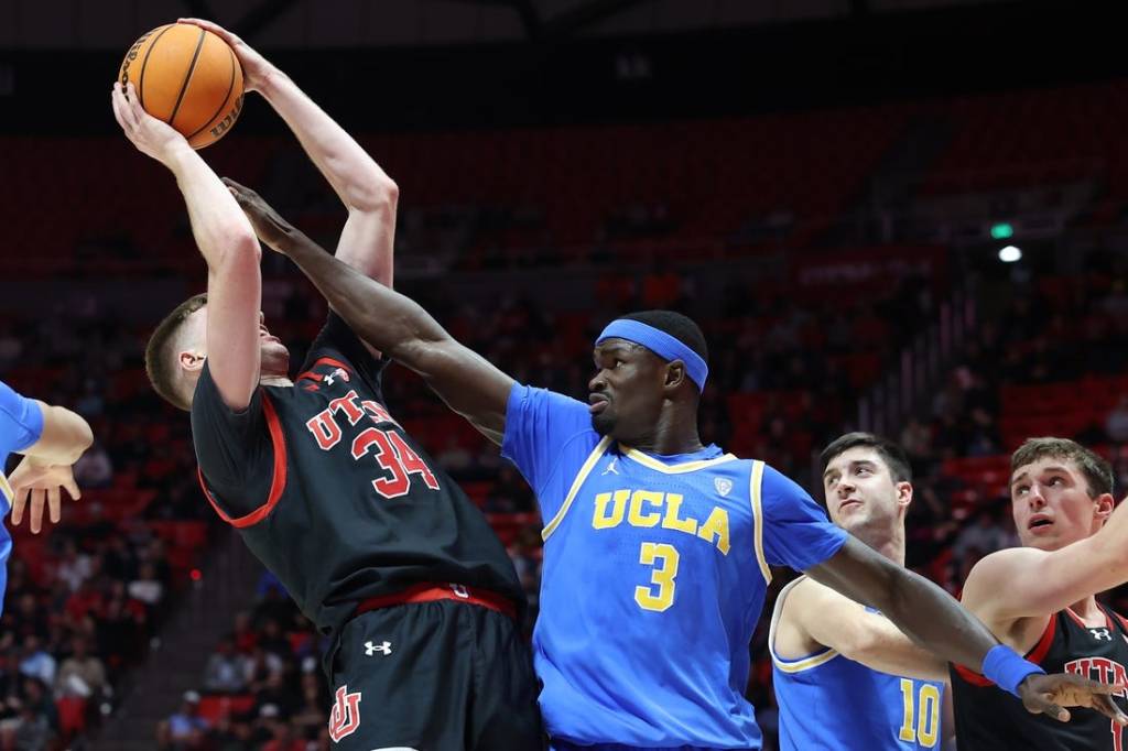 Jan 11, 2024; Salt Lake City, Utah, USA; UCLA Bruins forward Adem Bona (3) defends the shot of Utah Utes center Lawson Lovering (34) during the second half at Jon M. Huntsman Center. Mandatory Credit: Rob Gray-USA TODAY Sports