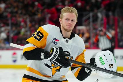 Jan 13, 2024; Raleigh, North Carolina, USA;  Pittsburgh Penguins left wing Jake Guentzel (59) looks on at the start of the game against the Carolina Hurricanes at PNC Arena. Mandatory Credit: James Guillory-USA TODAY Sports