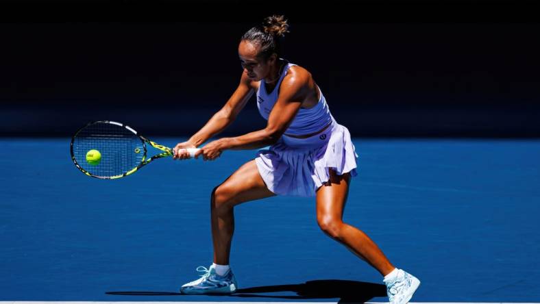 Jan 14, 2024; Melbourne, Victoria, Australia;  Leylah Fernandez of Canada hits a shot against Sarah Bejlek of the Czech Republic in the first round of the women s singles. Mandatory Credit: Mike Frey-USA TODAY Sports