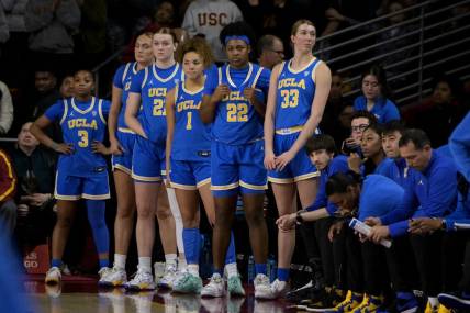 Jan 14, 2024; Los Angeles, California, USA; UCLA Bruins guard Londynn Jones (3), forward Angela Dugalic (32), forward Lina Sontag (21), guard Kiki Rice (1), forward Christeen Iwuala (22) and forward Amanda Muse (33) look on from the bench in the final seconds of the game at Galen Center. Mandatory Credit: Jayne Kamin-Oncea-USA TODAY Sports