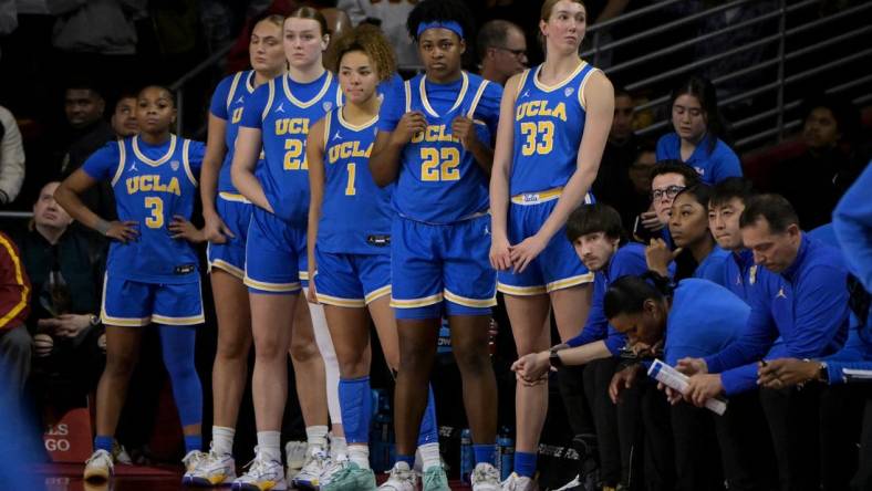 Jan 14, 2024; Los Angeles, California, USA; UCLA Bruins guard Londynn Jones (3), forward Angela Dugalic (32), forward Lina Sontag (21), guard Kiki Rice (1), forward Christeen Iwuala (22) and forward Amanda Muse (33) look on from the bench in the final seconds of the game at Galen Center. Mandatory Credit: Jayne Kamin-Oncea-USA TODAY Sports