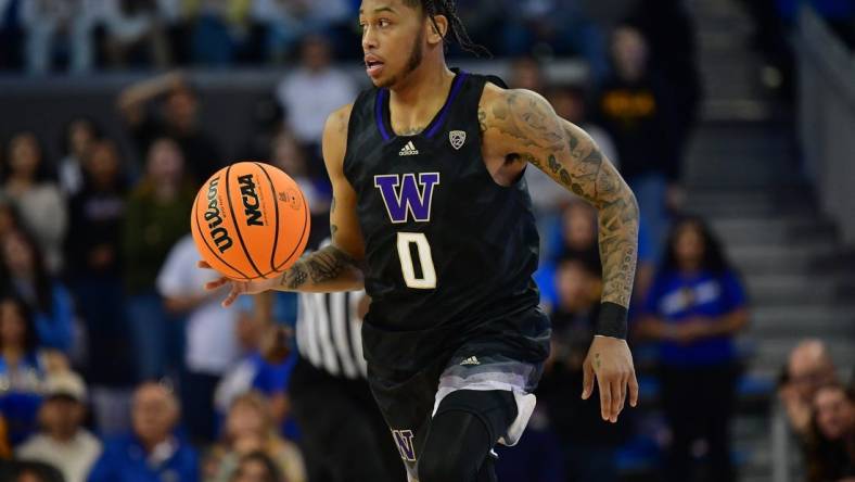 January 14, 2024; Los Angeles, California, USA; Washington Huskies guard Koren Johnson (0) brings the ball up court against the UCLA Bruins during the first half at Pauley Pavilion. Mandatory Credit: Gary A. Vasquez-USA TODAY Sports