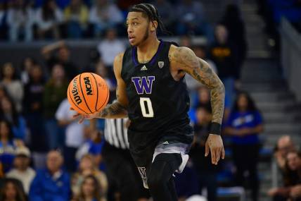 January 14, 2024; Los Angeles, California, USA; Washington Huskies guard Koren Johnson (0) brings the ball up court against the UCLA Bruins during the first half at Pauley Pavilion. Mandatory Credit: Gary A. Vasquez-USA TODAY Sports