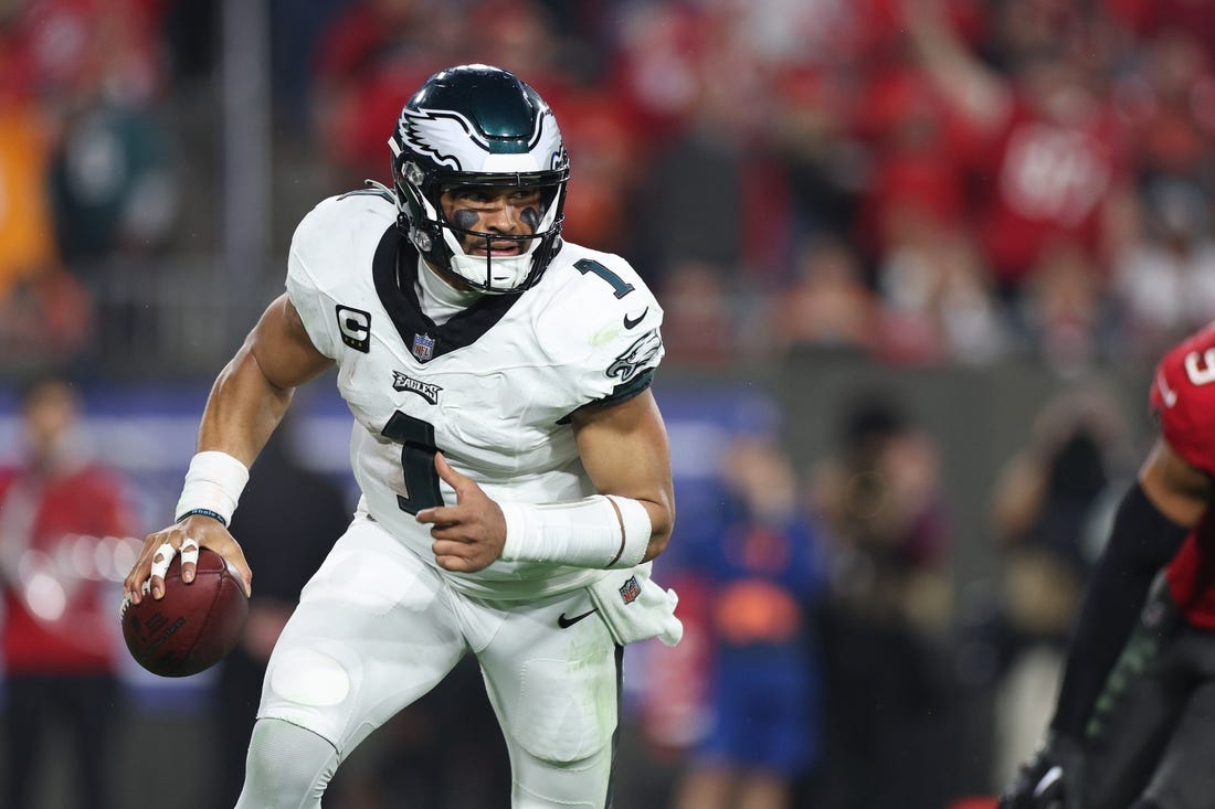 Jan 15, 2024; Tampa, Florida, USA; Philadelphia Eagles quarterback Jalen Hurts (1) runs with the ball during the second half of a 2024 NFC wild card game against the Tampa Bay Buccaneers at Raymond James Stadium. Mandatory Credit: Nathan Ray Seebeck-USA TODAY Sports