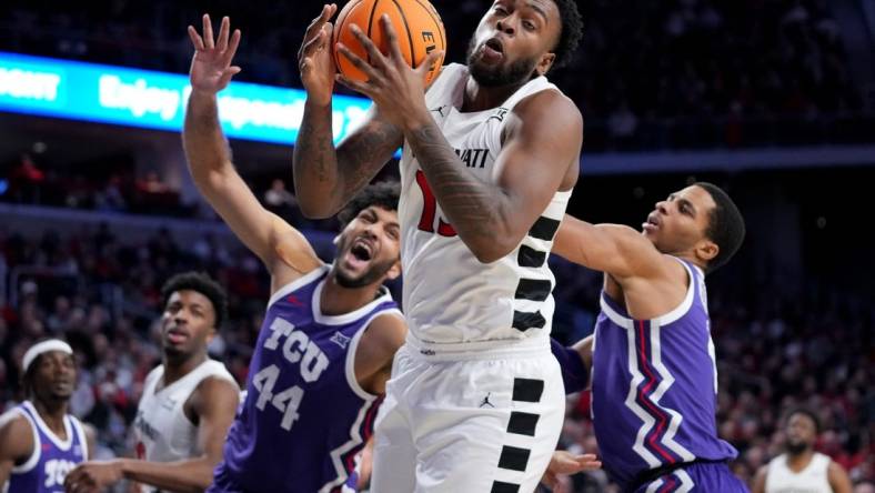 Cincinnati Bearcats forward Jamille Reynolds (13) rebounds the ball in the second half of a college basketball game between the TCU Horned Frogs and the Cincinnati Bearcats, Tuesday, Jan. 16, 2024, at Fifth Third Arena in Cincinnati. The Cincinnati Bearcats won, 81-77.