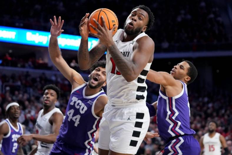Cincinnati Bearcats forward Jamille Reynolds (13) rebounds the ball in the second half of a college basketball game between the TCU Horned Frogs and the Cincinnati Bearcats, Tuesday, Jan. 16, 2024, at Fifth Third Arena in Cincinnati. The Cincinnati Bearcats won, 81-77.