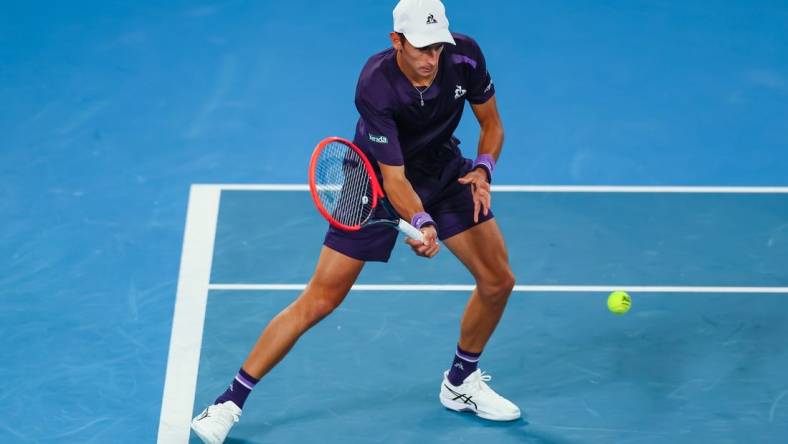 Jan 17, 2024; Melbourne, Victoria, Australia; Matteo Arnaldi of Italy plays a shot against Alex de Minaur (not pictured) of Australia in Round 2 of the Men's Singles on Day 4 of the Australian Open tennis at Rod Laver Arena. Mandatory Credit: Mike Frey-USA TODAY Sports