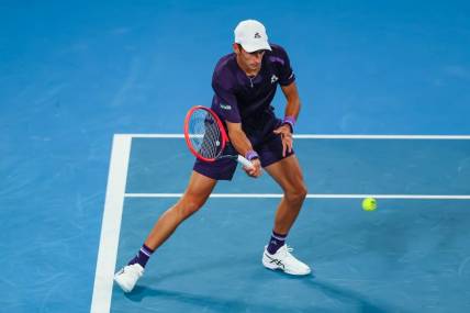 Jan 17, 2024; Melbourne, Victoria, Australia; Matteo Arnaldi of Italy plays a shot against Alex de Minaur (not pictured) of Australia in Round 2 of the Men's Singles on Day 4 of the Australian Open tennis at Rod Laver Arena. Mandatory Credit: Mike Frey-USA TODAY Sports