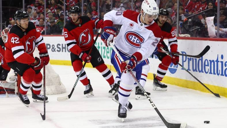 Jan 17, 2024; Newark, New Jersey, USA; Montreal Canadiens left wing Juraj Slafkovsky (20) skates with the puck against the Montreal Canadiens during the third period at Prudential Center. Mandatory Credit: Ed Mulholland-USA TODAY Sports