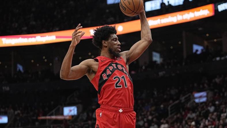 Jan 17, 2024; Toronto, Ontario, CAN; Toronto Raptors forward Thaddeus Young (21) comes down with a rebound against the Miami Heat during the first half at Scotiabank Arena. Mandatory Credit: John E. Sokolowski-USA TODAY Sports