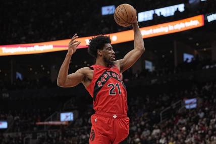Jan 17, 2024; Toronto, Ontario, CAN; Toronto Raptors forward Thaddeus Young (21) comes down with a rebound against the Miami Heat during the first half at Scotiabank Arena. Mandatory Credit: John E. Sokolowski-USA TODAY Sports