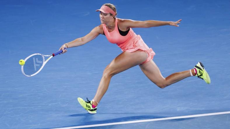 Jan 18, 2024; Melbourne, Victoria, Australia; Danielle Collins of the United States plays a shot against Iga Swiatek (not pictured) of Poland in Round 2 of the Women's Singles on Day 5 of the Australian Open tennis at Rod Laver Arena. Mandatory Credit: Mike Frey-USA TODAY Sports