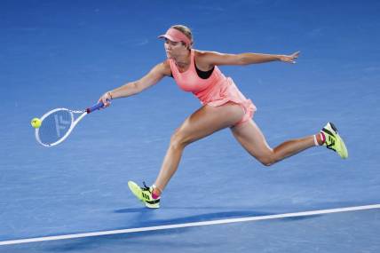 Jan 18, 2024; Melbourne, Victoria, Australia; Danielle Collins of the United States plays a shot against Iga Swiatek (not pictured) of Poland in Round 2 of the Women's Singles on Day 5 of the Australian Open tennis at Rod Laver Arena. Mandatory Credit: Mike Frey-USA TODAY Sports