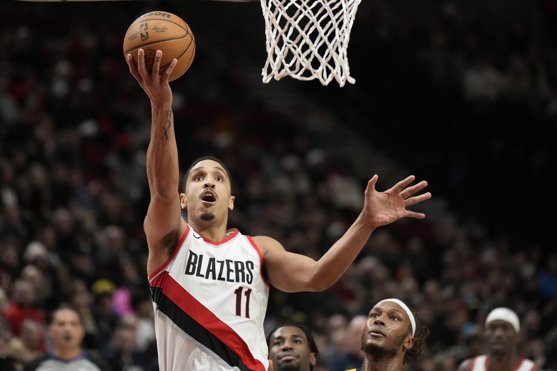 Jan 19, 2024; Portland, Oregon, USA; Portland Trail Blazers point guard Malcolm Brogdon (11) shoots the ball during the second half against the Indiana Pacers at Moda Center. Mandatory Credit: Soobum Im-USA TODAY Sports