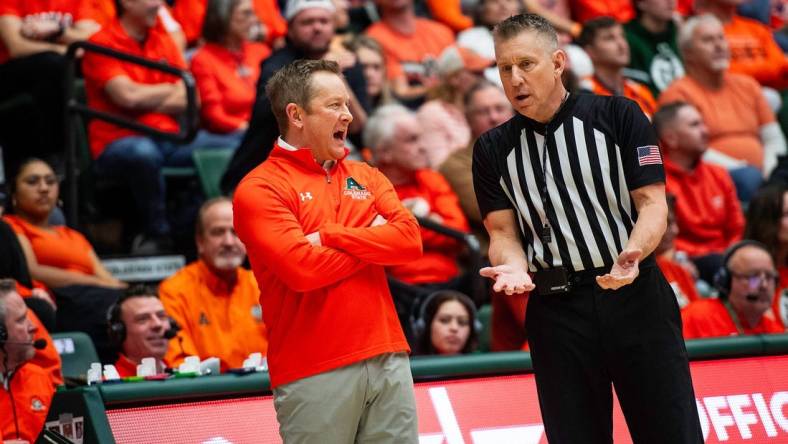 Colorado State's head coach Nico Medved talks with an offical during a game against UNLV at Moby Arena in Fort Collins, Colo., on Friday, Jan. 19, 2024.